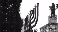 
	Giant menorahs in front of government buildings and in public squares have become a staple of the Holiday season and Jewish cultural and religious life, but the pioneering public menorahs of the 80’s faced stiff legal battles.

	In 1986, Chabad-Lubavitch of Pittsburgh erected its annual menorah display in front of City-County Building