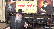 
	The Rebbe carries two buckets of paint for a woman….