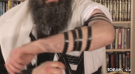 
	
		
			Blessing for the Tefillin:
		
			
			
		
			 
		
			Boruch ato Adonoy Elohay-nu Melech ho-olom asher kid’shonu b’mitzvosov v’tzivonu le'honiach Tefillin
		
			
			
		
			Blessed are you, Lord, our God, sovereign of the universe, Who has sanctified us with His commandments and commanded us to put on Tefillin
		
			
			
		
			
			
		
			Created by Raymond Lyons & Rabbi Nissan Dubov - Introduced by Chief Rabbi Lord Sacks - Produced by Jeremy Wootliff & Worthwhile