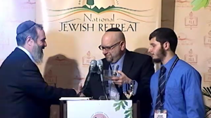 
	This segment introduces the journalist-rabbi-blogger, David Nesenoff, as he is presented with an award at the National Jewish Retreat. David Nesenoff captured the anti-semitic statements of White House correspondent, Helen Thomas, that ricocheted throughout the political world and ultimately resulted in Thomas’ retirement